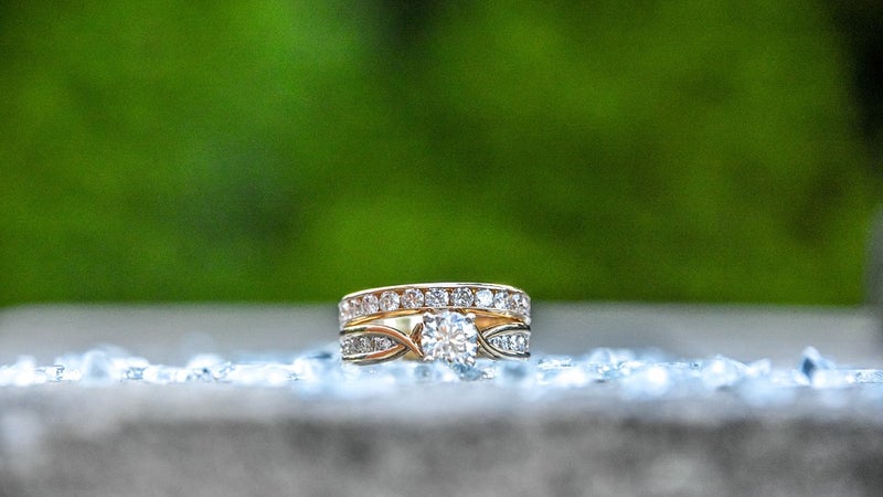 Diamond ring with a green background