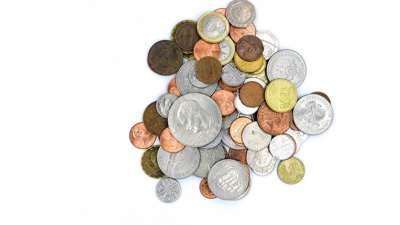 Coins in a pile on a white background