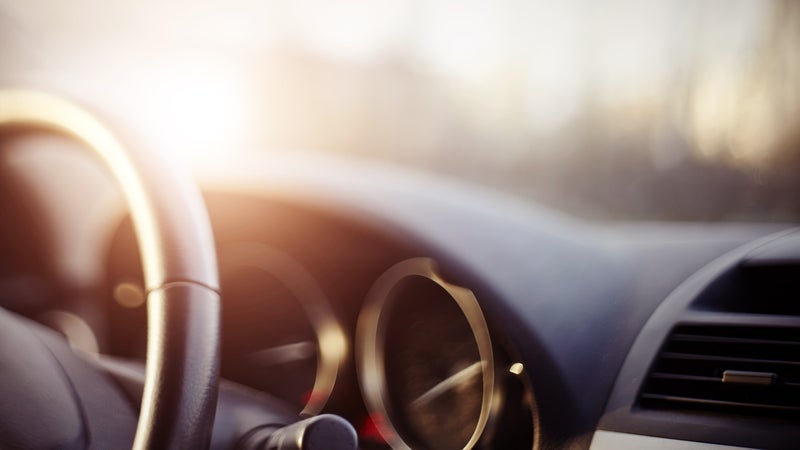 The steering wheel and dashboard of a car