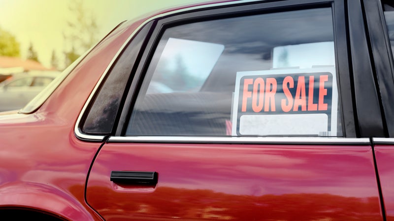 Car window with a for sale sign