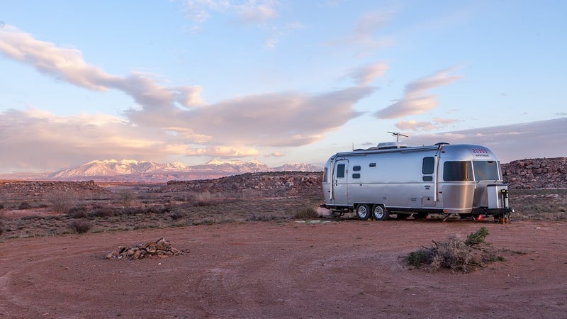 A silver mobile home in the desert